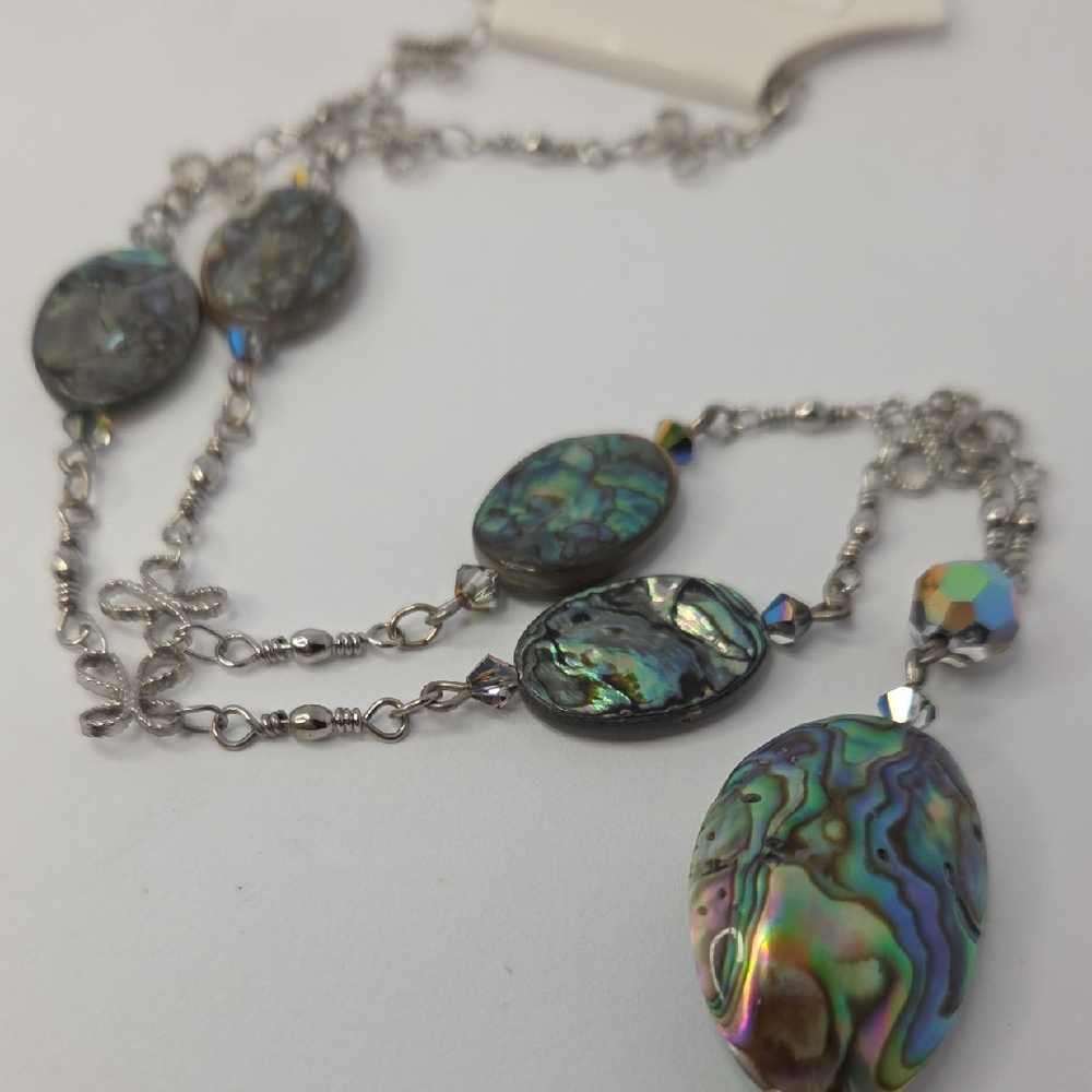 Necklace featuring natural abalone shell pendants set in a silver-toned chain